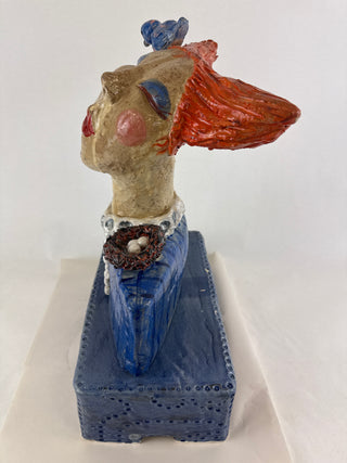 Flat Lady Sculpture with birdsnest