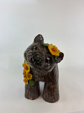 Sculpture-wombat yellow flowers